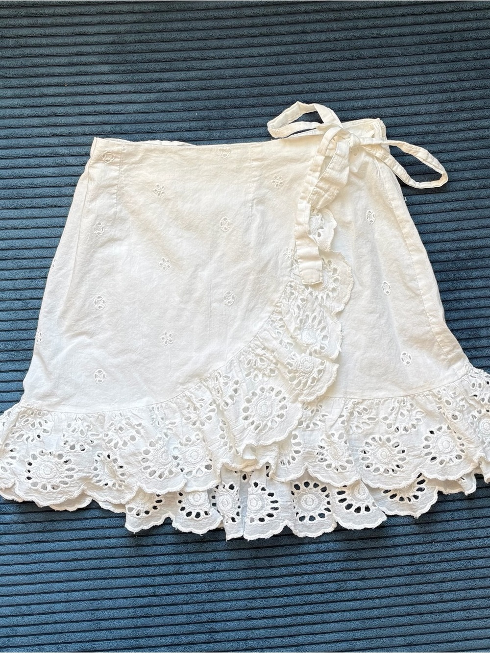 Japan wrap mini skirt with ruffled eyelet hem